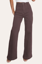 Chocolate pintuck flare jeans with front seam laid flat, showcasing seamed wide leg jeans design.